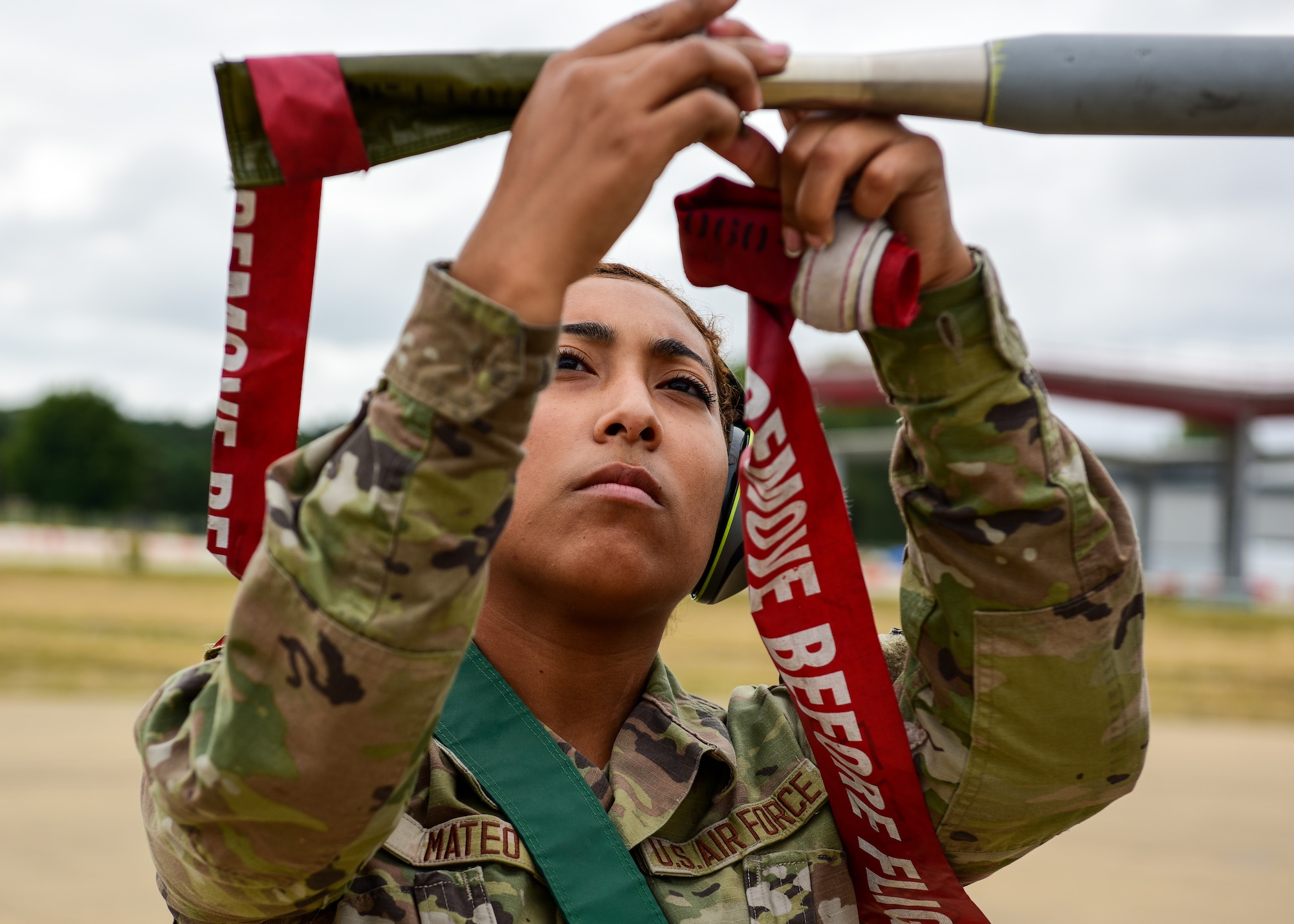 Airman 1st Class Lynmarie Mateo, 555th Fighter Generation Squadron weapons apprentice from the 31st Fighter Wing, Aviano Air Base, Italy, covers an F-16C Fighting Falcon pitot tube during post-flight checks