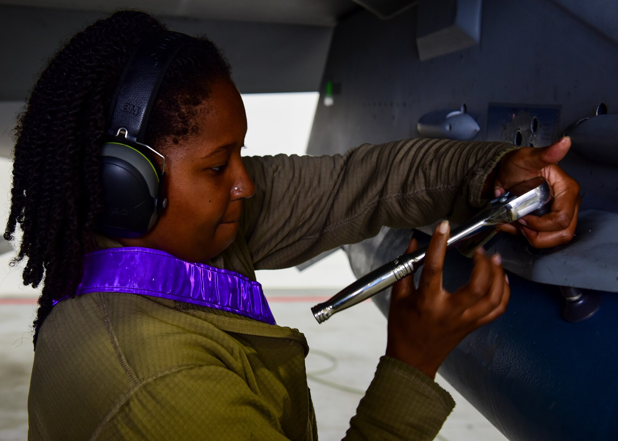U.S. Air Force Staff Sgt. Akeia Williams, 555th Fighter Generation Squadron weapons load crew member from the 31st Fighter Wing, Aviano Air Base, Italy, locks in a missile onto a F-16C Fighting Falcon during training for Cobra Warrior 2022