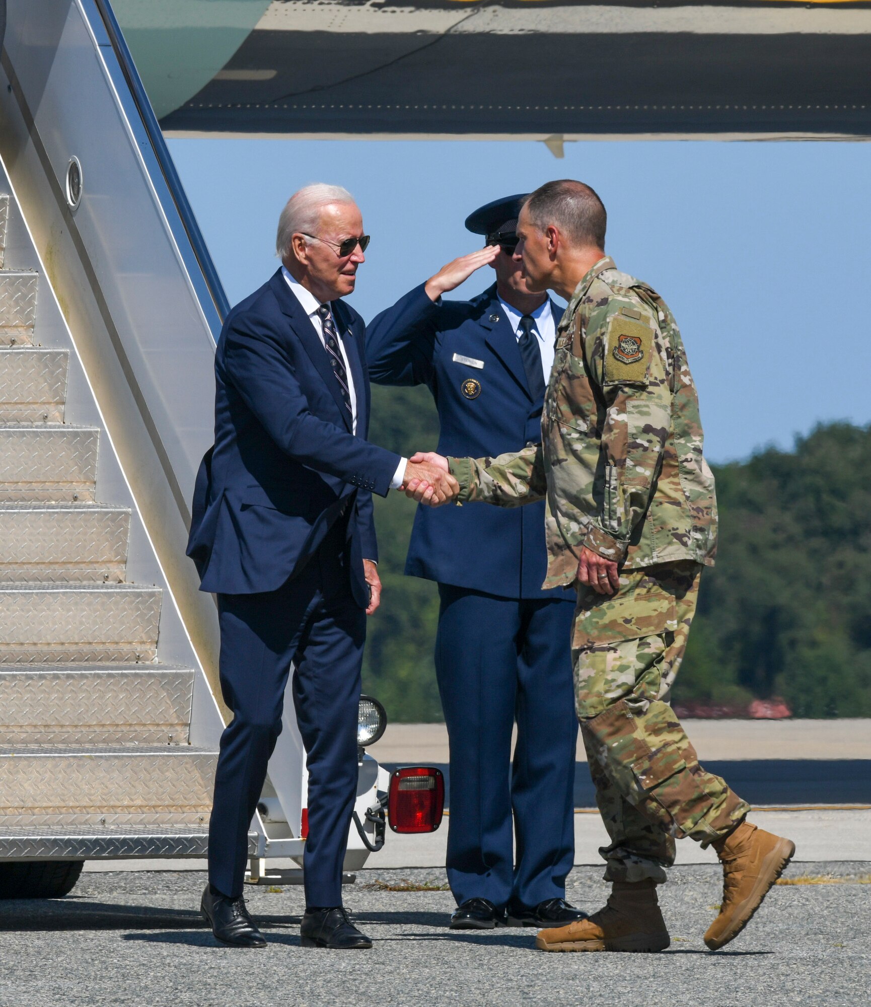 U.S. President Joe Biden, left, shakes hands with Col. Matt Husemann, 436th Airlift Wing commander, after arriving at Dover Air Force Base, Delaware, Sept. 9, 2022.