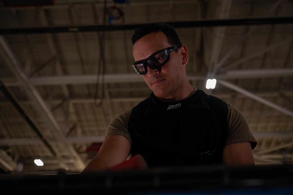Airmen demonstrate cooling vest