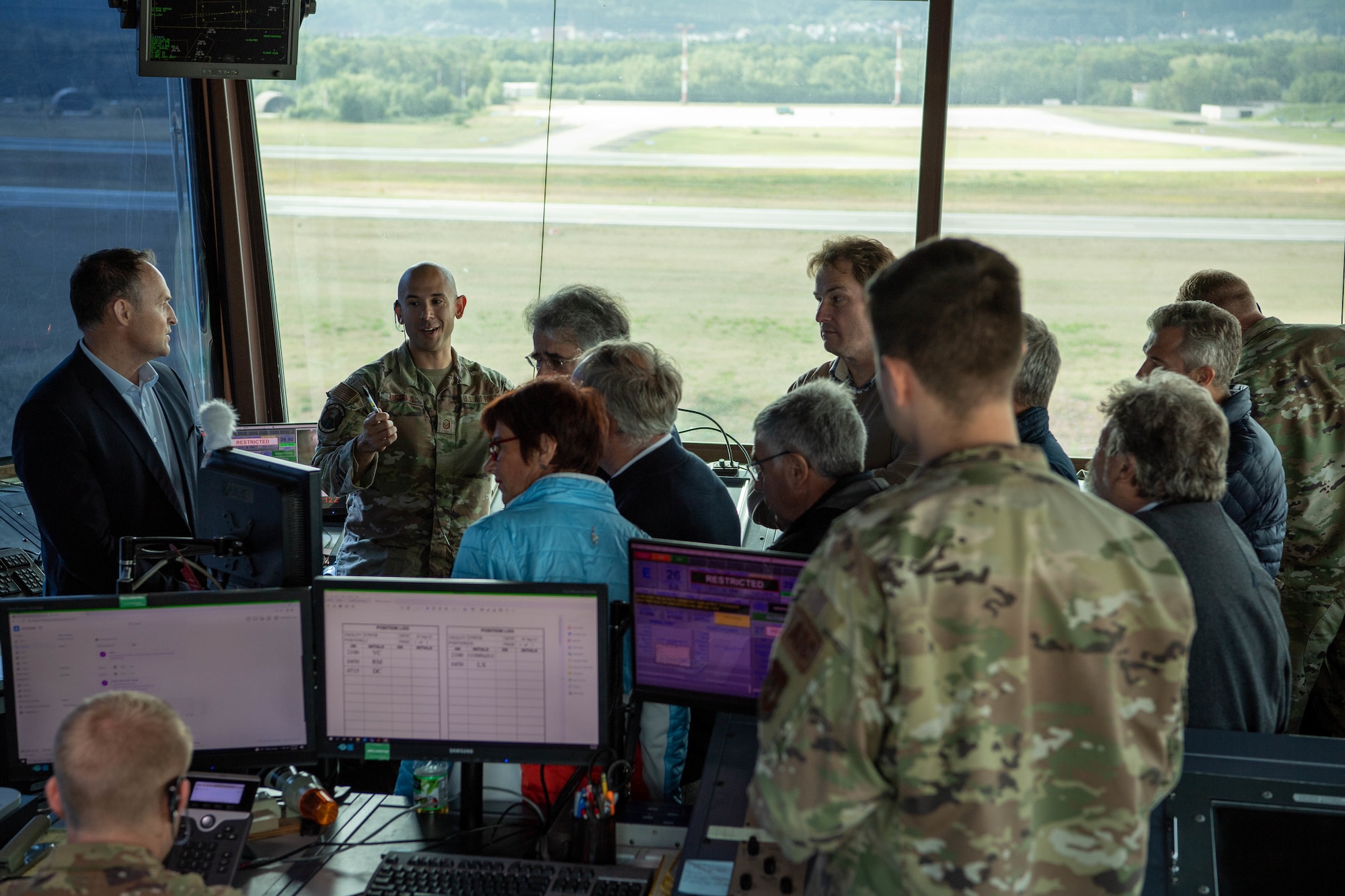 A group of glider pilots from various flying clubs in Rheinland-Pfalz tour the air traffic control tower located at Ramstein Air Base, Sept. 9, 2022, during a Mid-Air Collision Avoidance Meeting.