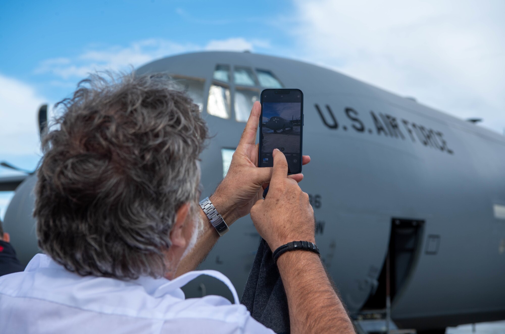 A glider pilot from a local flying club in Rheinland-Pfalz photographs a C-130J Super Hercules aircraft at Ramstein Air Base, Sept. 9, 2022 during a Mid-Air Collision Avoidance Meeting.