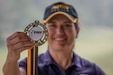 U.S. Army Reserve Col. Sunny K. Mitchell, officer-in-charge, recruiting and retention, U.S. Army Reserve Command, holds her All Army Golf Championship medal she was awarded for winning the women's division of the competition at Fort Belvoir, Virginia, September 10. Mitchell goes on to represent the U.S. Army  in the All Armed Forces Golf Championship being held at Fort Belvoir, Sept. 11-14. (Official U.S. Army Reserve photo by Sgt. 1st Class Brent C. Powell)