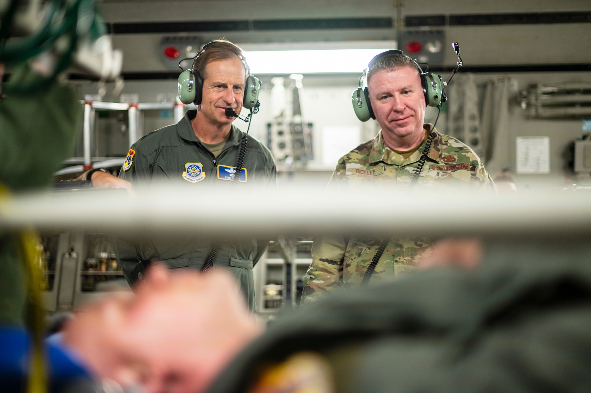 Airmen watch a training being conducted.