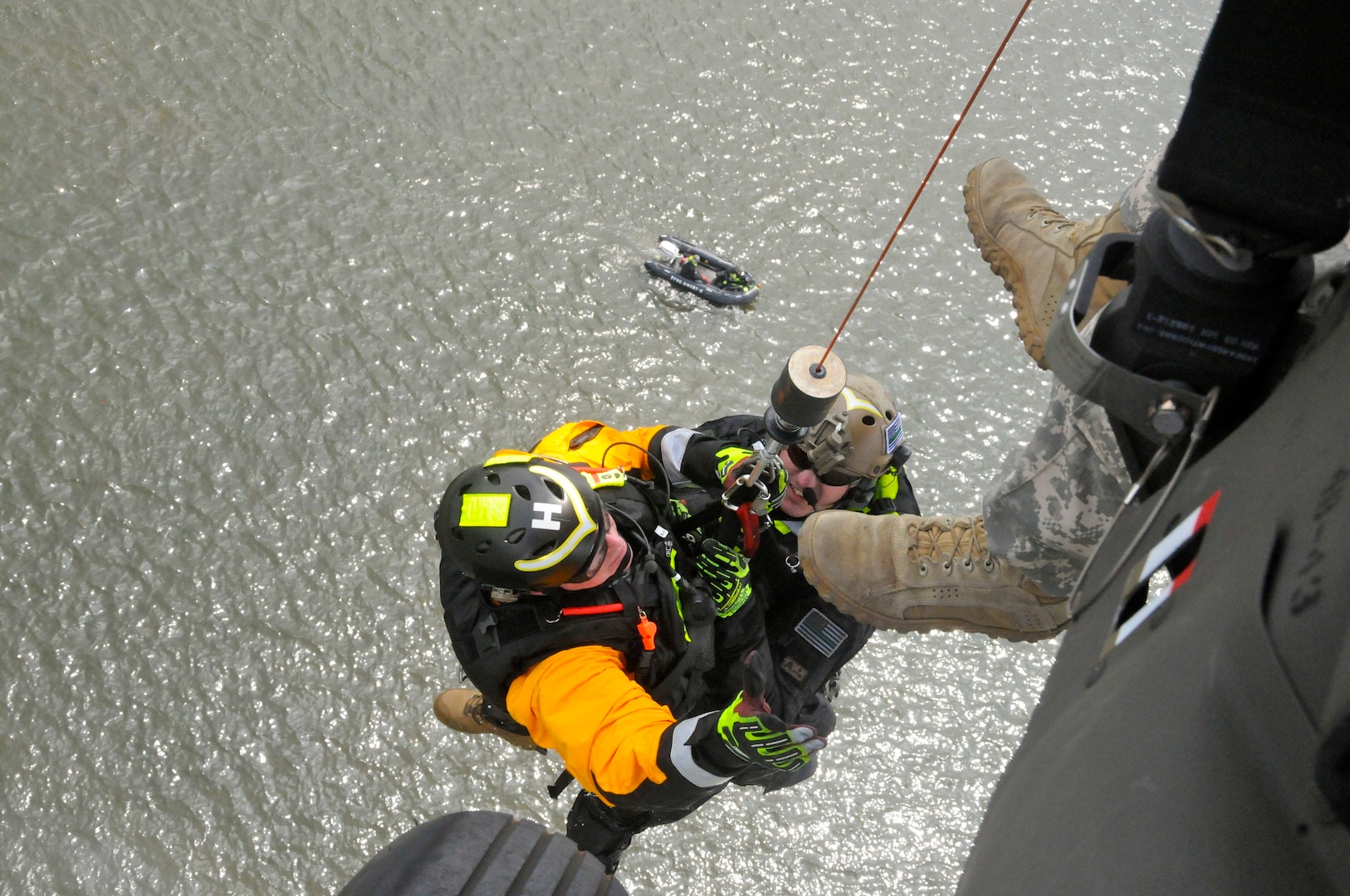 Rescue technicians with the Pennsylvania Helicopter Aquatic Rescue Team train on a hoist during an emergency response exercise in Harrisburg, Pennsylvania, Aug. 15, 2019. 28th ECAB Soldiers worked with their partners in PA-HART and other civilian first responders during the exercise, named “Operation Hurricane.” PA-HART is a joint partnership between the Pennsylvania National Guard, Pennsylvania Fish and Boat Commission, Pennsylvania Emergency Management Agency and certified civilian rescue technicians. It is an aerial search and rescue team, able to assist citizens during disasters.