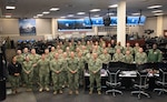 220908-N-CI480-0001 NORFOLK (Sept. 8, 2022) Rear Adm. Robert C. Nowakowski, Reserve vice commander, U.S. Naval Forces Central Command, and approximately 50 Reserve Sailors gather during a maritime operations center exercise in Norfolk. The maritime operations center exercise, comprised of all 5th Fleet Reserve units, is training by Reserve Sailors, for Reserve Sailors to strategically align with mission requirements supporting the fleet in four lines of mobilize-to-billet effort: design, train, mobilize and develop. (U.S. Navy photo by Ian P. Delossantos, visual information specialist)