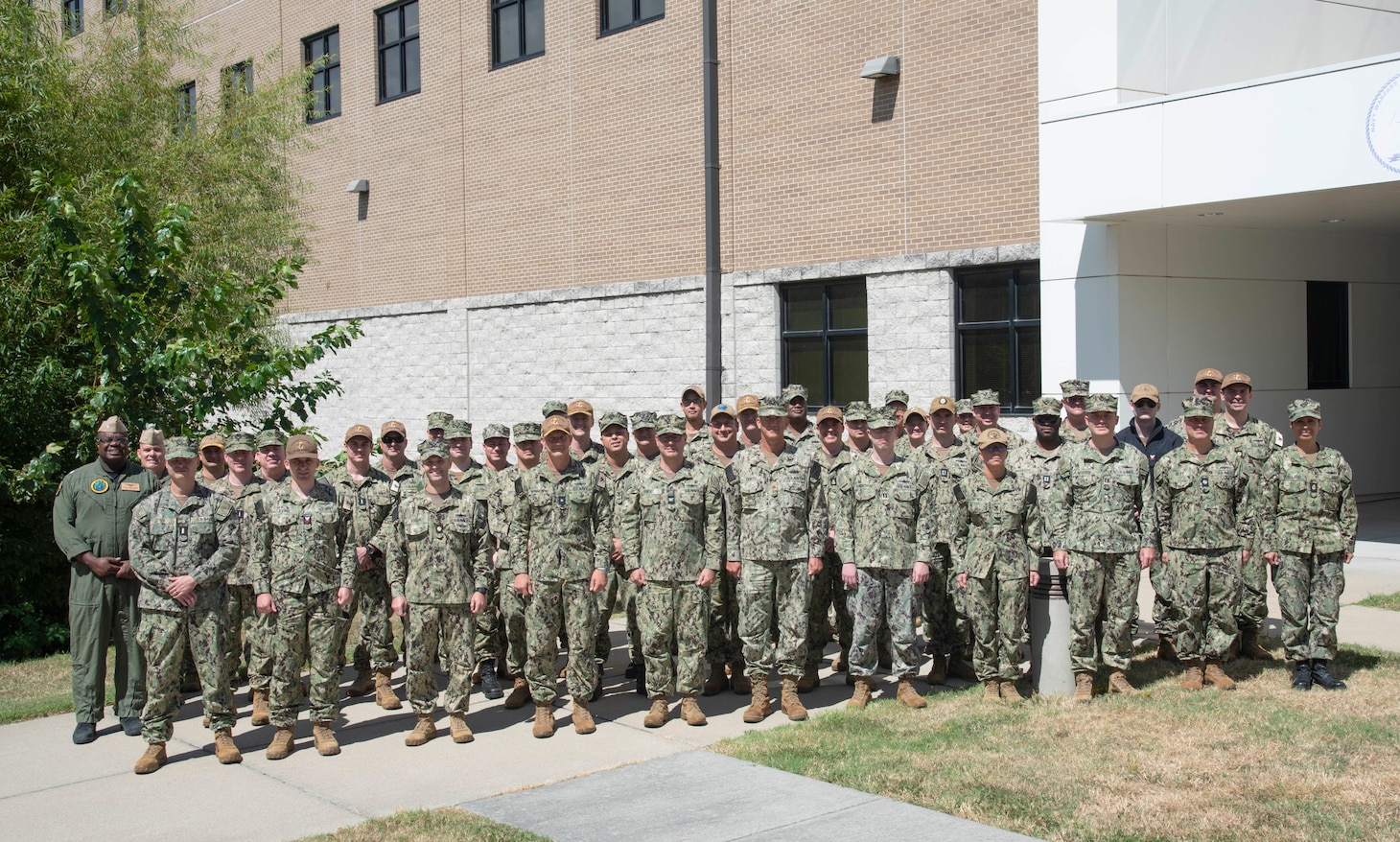 Rear Adm. Robert C. Nowakowski, Reserve vice commander, U.S. Naval Forces Central Command poses with other Reserve Sailors during a maritime operations center exercise in Norfolk. The maritime operations center exercise, comprised of 10 units, is a training exercise by Reserve Sailors, for Reserve Sailors to strategically align with mission requirements to support the fleet in the four lines of effort which are design, train, mobilize and develop. (U.S. Navy photo by Mass Communication Specialist 1st Class Helen Brown)