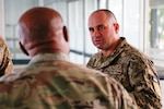 Ukrainian Chief Master Sgt. Oleksandr Kosynskyi, the command senior enlisted leader of the Armed Forces of Ukraine, talks with Senior Enlisted Advisor Tony Whitehead, the SEA to the chief, National Guard Bureau, during the Supreme Headquarters Allied Powers Europe International Command Senior Enlisted Conference in Casteau, Belgium, Sept. 7, 2022.