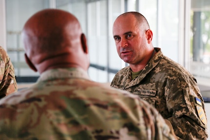 Ukrainian Chief Master Sgt. Oleksandr Kosynskyi, the command senior enlisted leader of the Armed Forces of Ukraine, talks with Senior Enlisted Advisor Tony Whitehead, the SEA to the chief, National Guard Bureau, during the Supreme Headquarters Allied Powers Europe International Command Senior Enlisted Conference in Casteau, Belgium, Sept. 7, 2022.