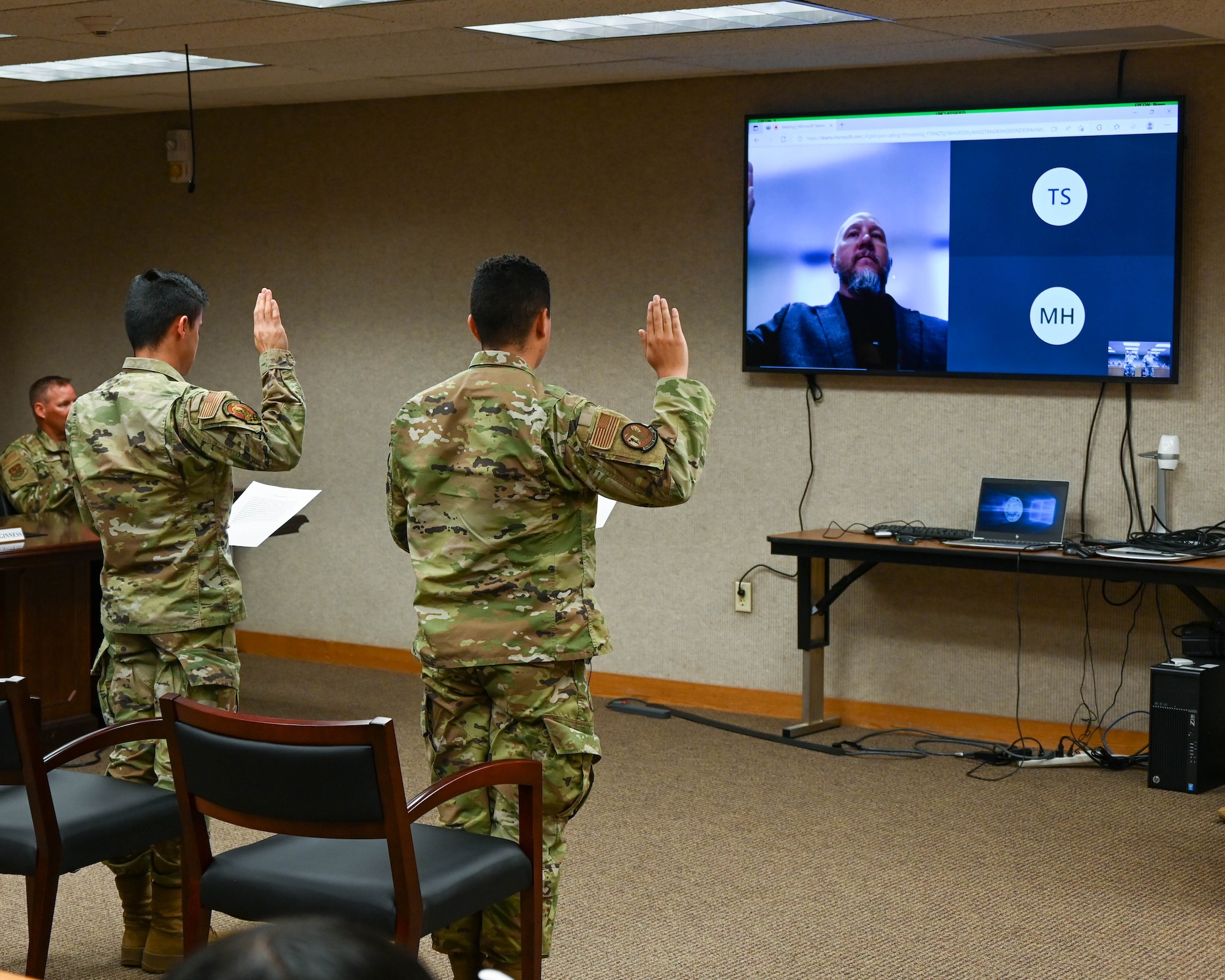 Airman Amin Ahmadi, a 5th Logistics Readiness Squadron traffic management office apprentice, and Airman 1st Class Jorge Peralta, a 5th Force Support Squadron classification technician, recite the Naturalization Oath of Allegiance to the United States of America at Minot Air Force Base, N.D., Aug. 31, 2022. The history of the Naturalization Oath of Allegiance goes back to the 18th Century. Applicants have recited an Oath of Allegiance since the first naturalization law in 1790. (U.S. Air Force photo by Senior Airman Evan Lichtenhan)
