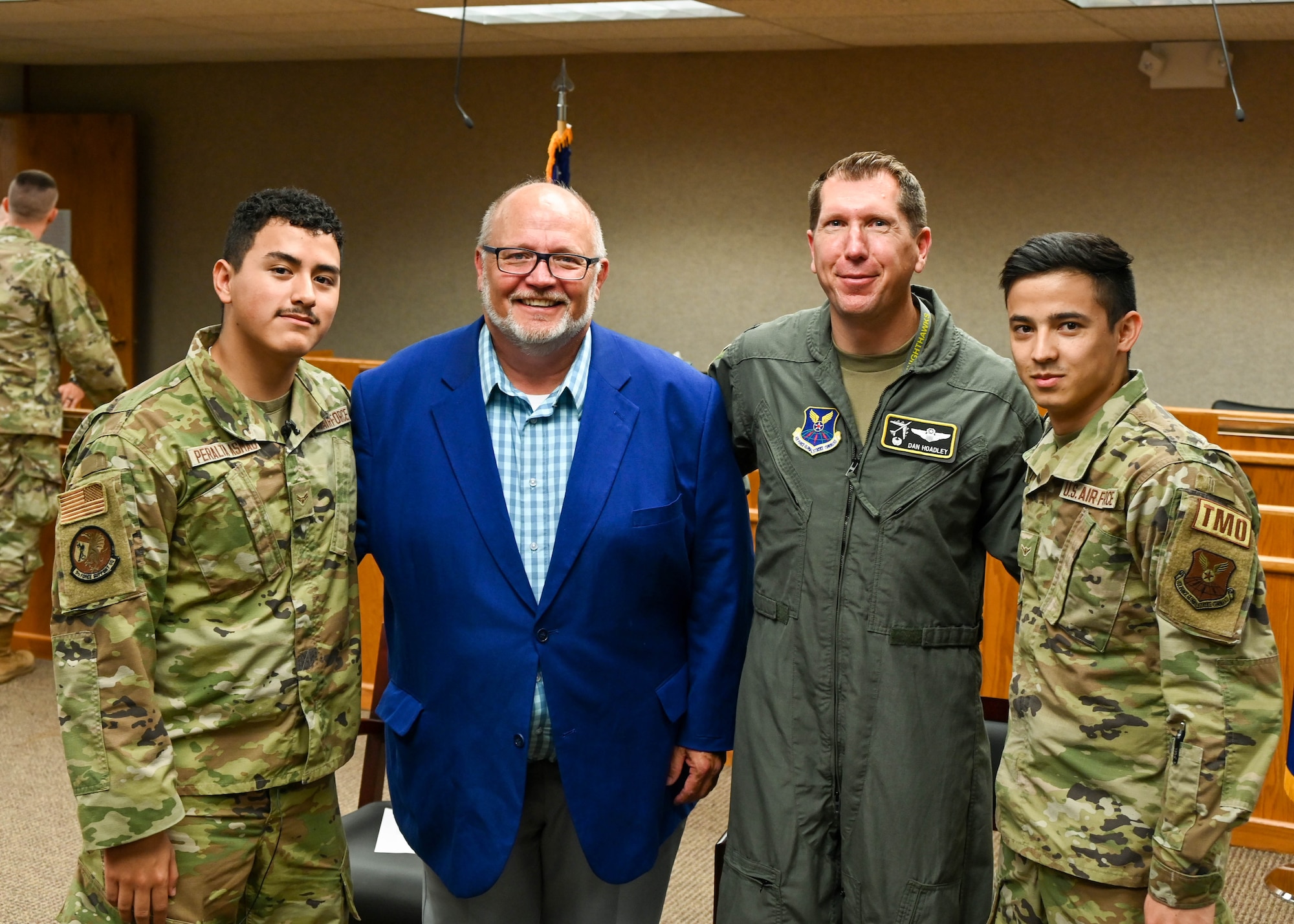 Airman 1st Class Jorge Peralta, a 5th Force Support Squadron classification technician, Tom Ross, mayor of Minot, Col. Daniel Hoadley, 5th Bomb Wing commander and, Airman Amin Ahmadi, a 5th Logistics Readiness Squadron traffic management office apprentice, pose for photo after a naturalization ceremony at Minot Air Force Base, N.D., Aug 31, 2022. Ahmadi and Peralta participated in the first naturalization ceremony held at Minot Air Force Base. For more than 200 years the oath has been recited by many Americans on their pathway to citizenship.  (U.S. Air Force photo by Senior Airman Evan Lichtenhan)