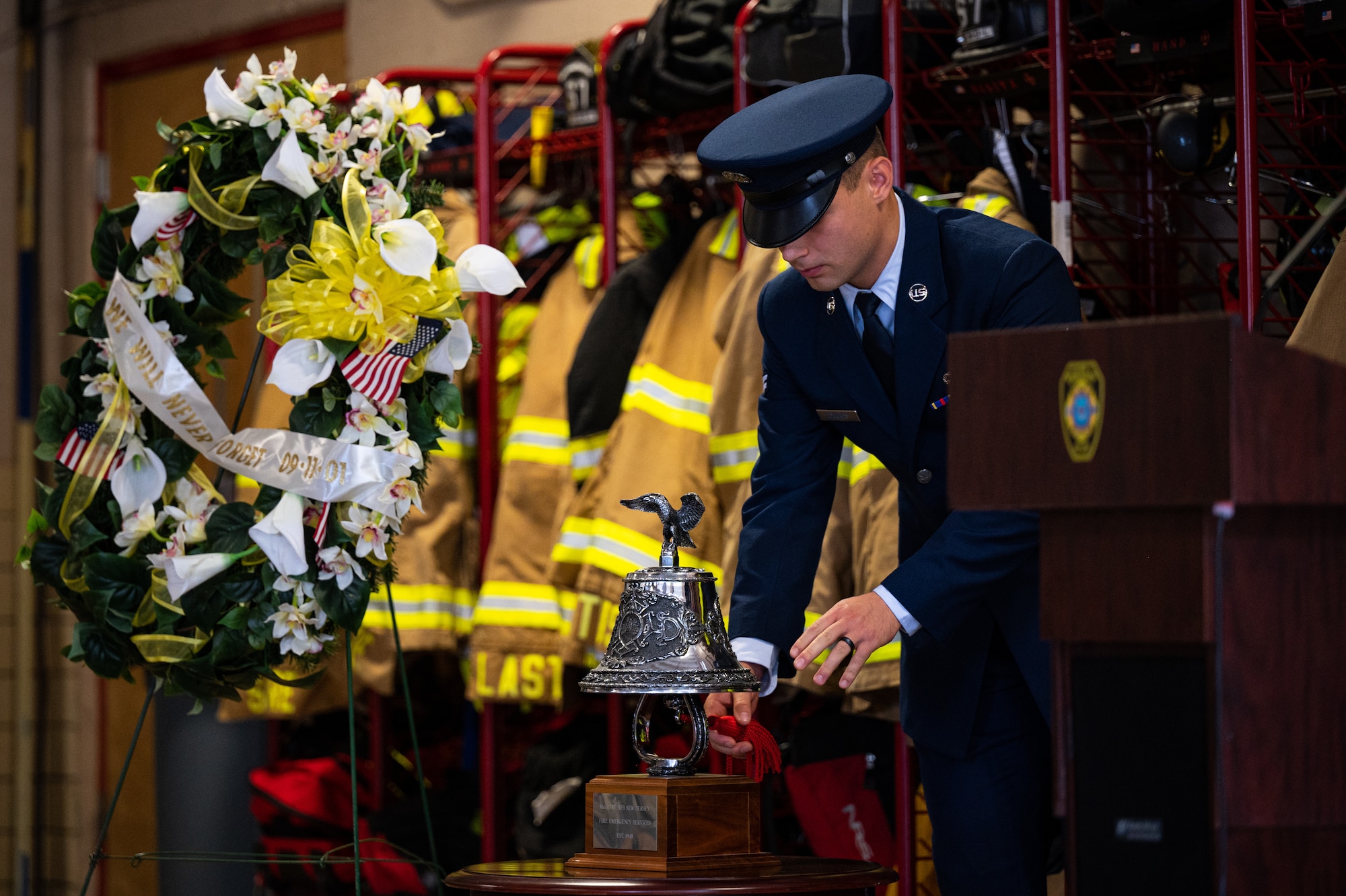A U.S. Air Force Airman assigned to Joint Base McGuire-Dix-Lakehurst rings the ceremonial bell during the 9/11 remembrance ceremony at Joint Base MDL, N.J., Sept. 11, 2022.