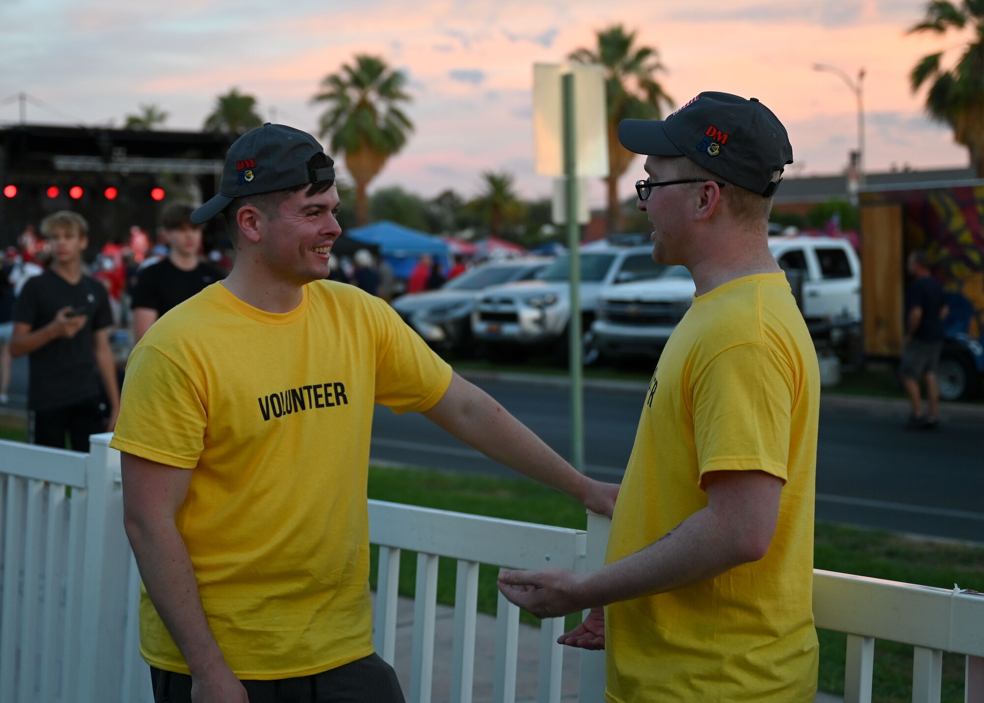 A photo of two men talking.