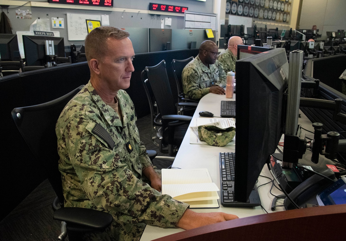 Lt. Cmdr. Thomas Curtis, an analyst attached to U.S. Naval Forces Central Command reviews information during a maritime operations center exercise in Norfolk. The maritime operations center exercise, comprised of 10 units, is a training exercise by Reserve Sailors, for Reserve Sailors to strategically align with mission requirements to support the fleet in the four lines of effort which are design, train, mobilize and develop. (U.S. Navy photo by Mass Communications Specialist 1st Class Helen Brown)