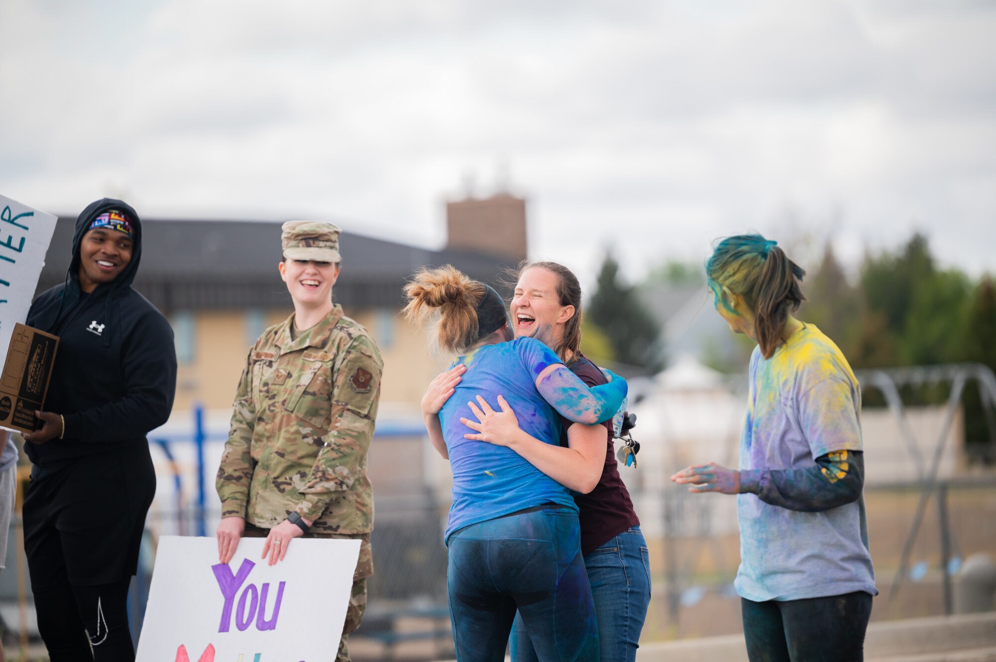Lt. Col. Corrie Pecoraro, 341st Force Support Squadron commander, hugs Serena Sargent, 341st Missile Wing violence prevention integrator, after crossing the finish line during a Suicide Awareness Color Run Sept. 9, 2022, at Malmstrom Air Force Base, Mont.