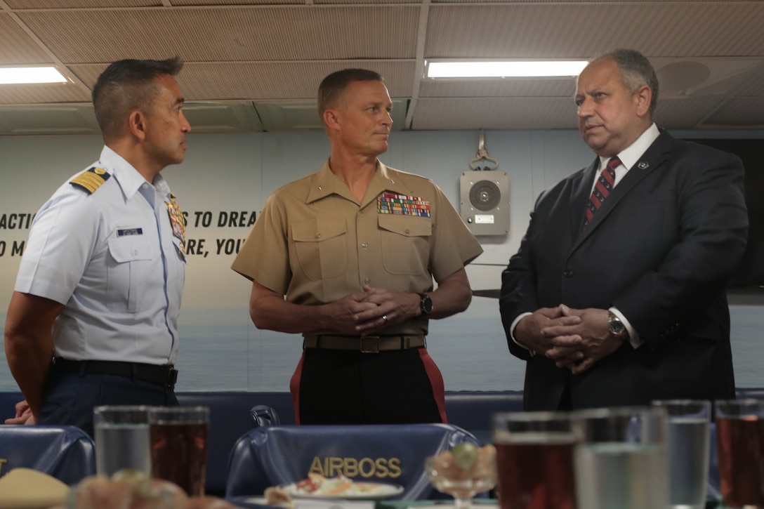 RIO DE JANEIRO (Sept. 8, 2022) From left, U.S. Coast Guard Capt. Flip Capistrano, Coast Guard attaché Brazil, U.S. Marine Corps Brig. Gen. Len “Loni” Anderson, the commanding general of 4th Marine Aircraft Wing, Marine Forces Reserve, and U.S. Secretary of the Navy Carlos Del Toro, talk after the opening ceremony for exercise UNITAS LXIII, during a tour aboard the USS Mesa Verde (LPD 19) on Ilha de Mocangue Naval Base, Rio de Janeiro, Sept. 8, 2022.
