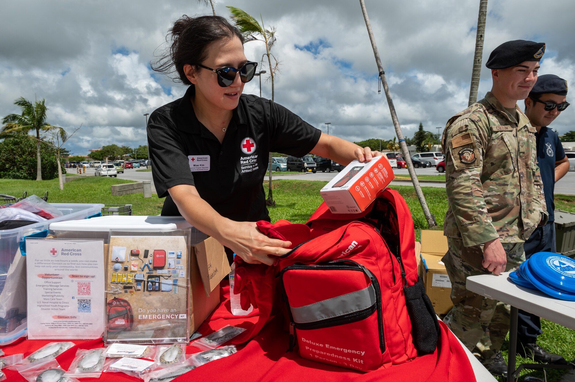 A Red Cross worker pulls content out of a emergency preparedness kit