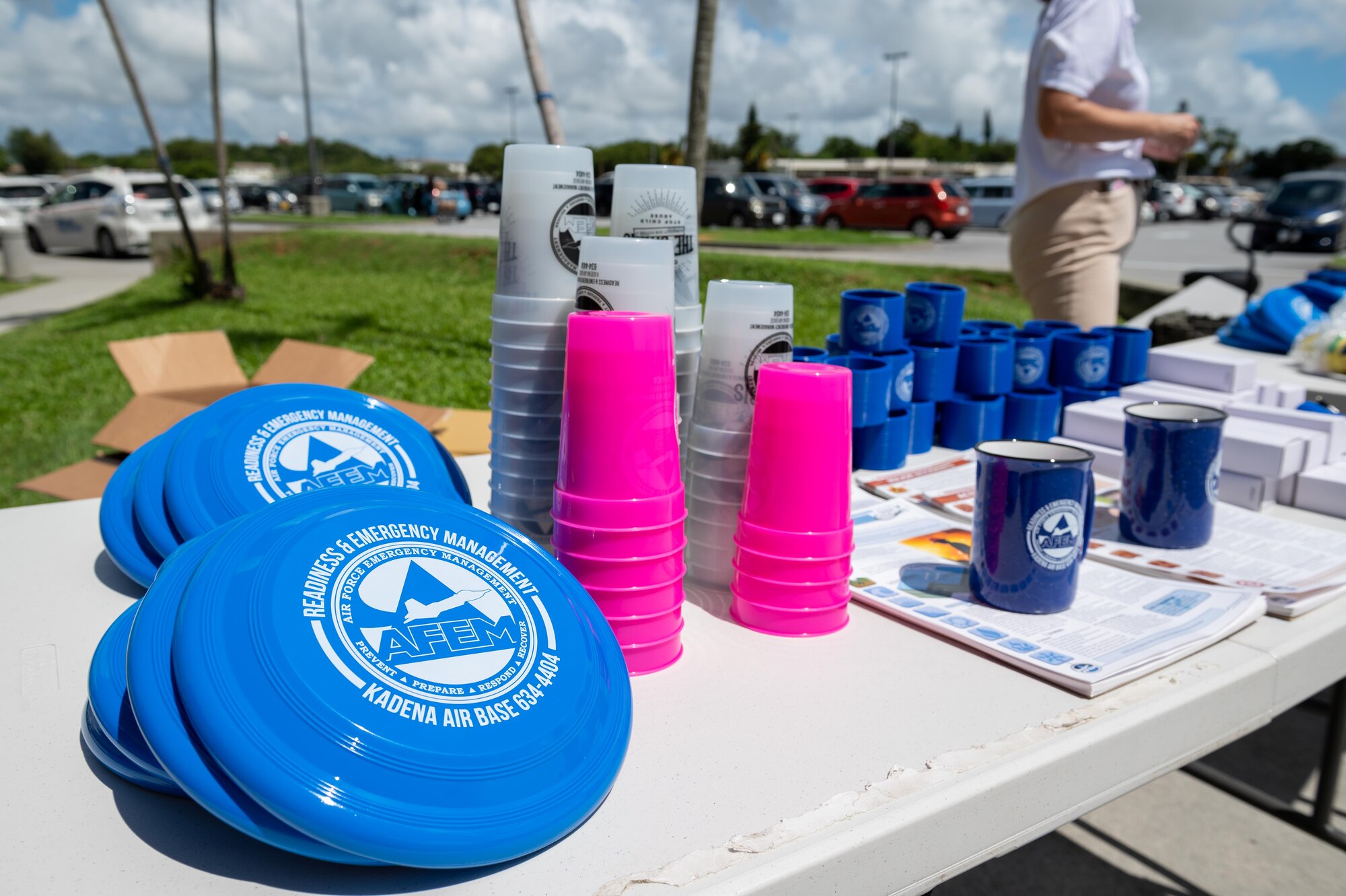 Air Force Emergency Management freebies are displayed on a table