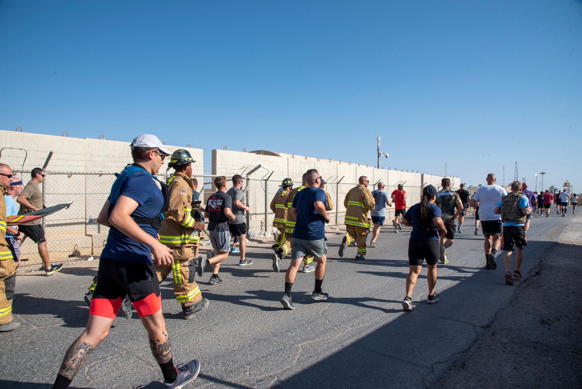 Airmen with the 332d Air Expeditionary Wing participate in a Patriot Day 5k run at an undisclosed location in Southwest Asia, Sept. 11, 2022. Patriot Day is a holiday memorializing the lives lost in the terrorist attacks September 11, 2001, and honoring those who have fought in the Global War on Terror ever since. (U.S. Air Force photo by: Tech. Sgt. Jim Bentley)
