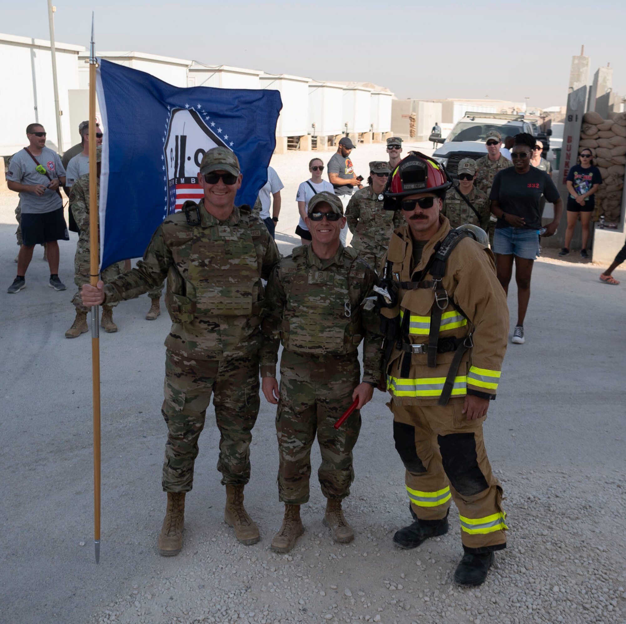 The 332d Air Expeditionary Wing honors those lives lost during the September 11 terrorist attacks in 2001. The 332d AEW held a 24 hour stair climb, the “Run to Remember” 5k, an unveiling of a 9/11 themed T-wall, Emergency Services interactive display, a flyover, cookout, 9/11 themed movie night and a memorial ceremony that showed a screening of a documentary  showcasing the sequence of events during the attacks. (U.S. Air Force photo by Tech. Sgt. Jeffery Foster)