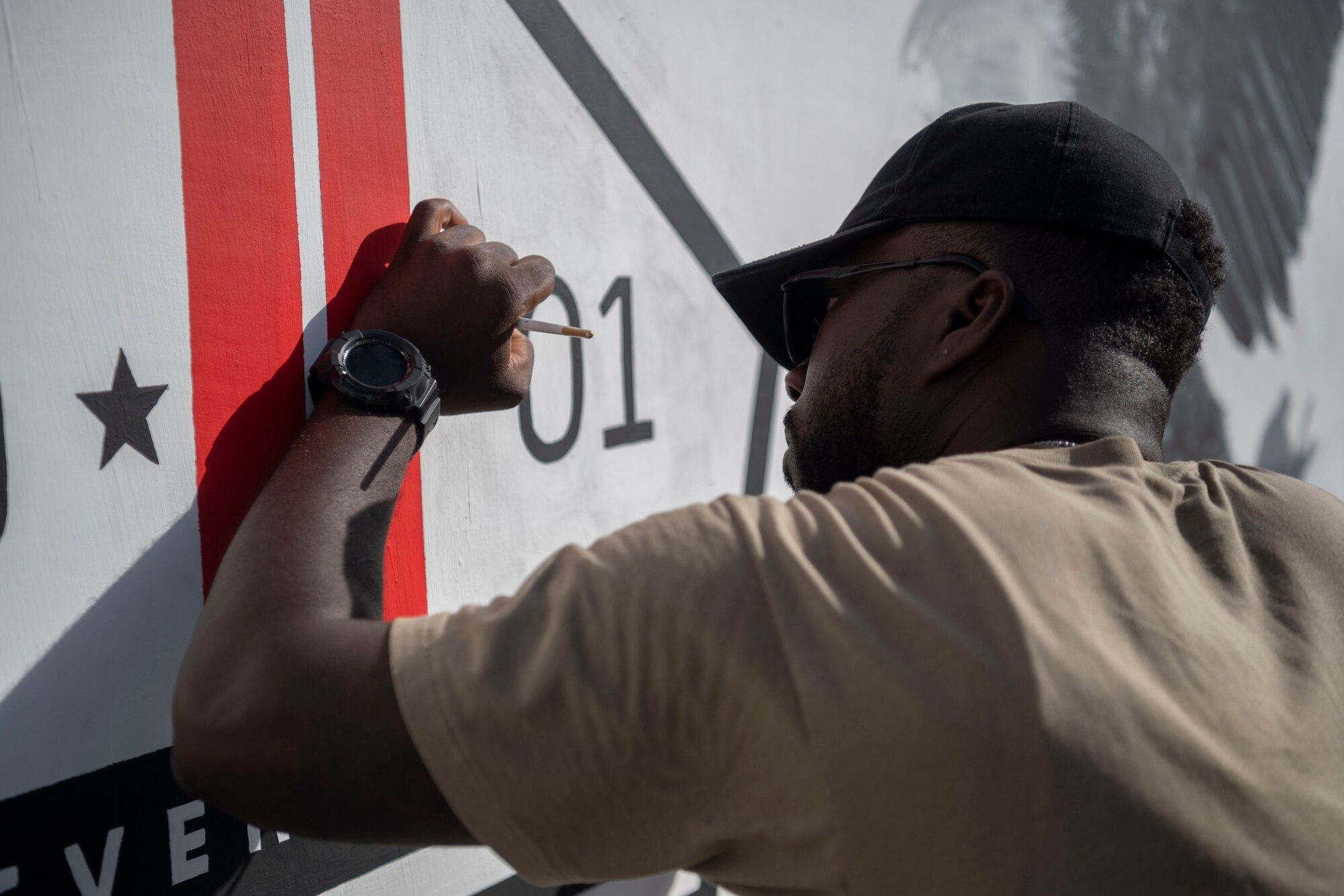 The 332d Air Expeditionary Wing honors those lives lost during the September 11 terrorist attacks in 2001. The 332d AEW held a 24 hour stair climb, the “Run to Remember” 5k, an unveiling of a 9/11 themed T-wall, Emergency Services interactive display, a flyover, cookout, 9/11 themed movie night and a memorial ceremony that showed a screening of a documentary  showcasing the sequence of events during the attacks. (U.S. Air Force photo by Tech. Sgt. Jeffery Foster)