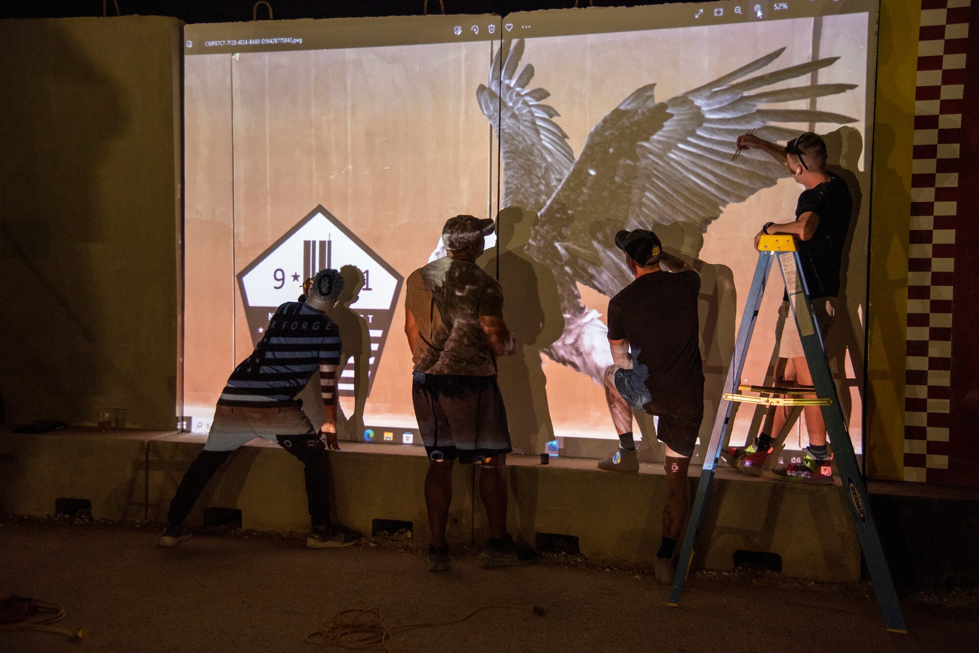 The 332d Air Expeditionary Wing honors those lives lost during the September 11 terrorist attacks in 2001. The 332d AEW held a 24 hour stair climb, the “Run to Remember” 5k, an unveiling of a 9/11 themed T-wall, Emergency Services interactive display, a flyover, cookout, 9/11 themed movie night and a memorial ceremony that showed a screening of a documentary  showcasing the sequence of events during the attacks. (U.S. Air Force photo by Tech. Sgt. James Bentley)