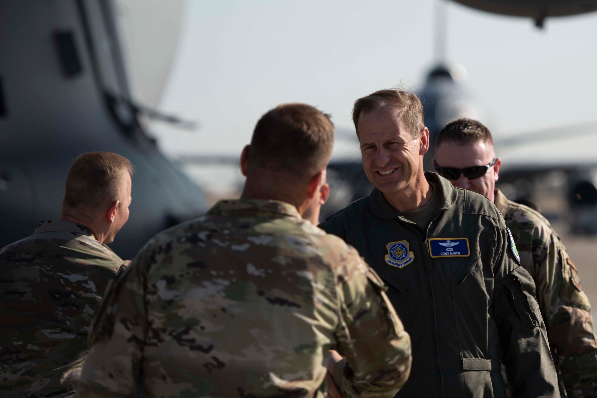 Airmen greet one another.