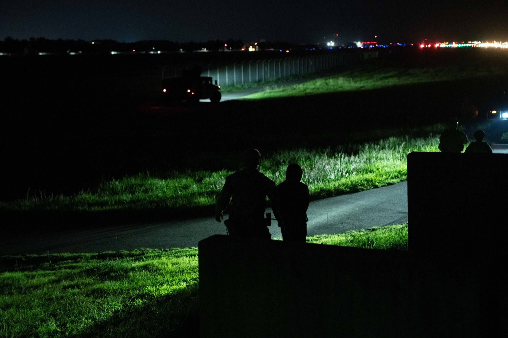 An 8th Security Forces Squadron patrolman escorts a simulated suspect during a training event at Kunsan Air Base, Republic of Korea, Sept. 11, 2022. After being apprehended, the suspects were taken back for identification and transportation. (U.S. Air Force photo by Staff Sgt. Sadie Colbert)