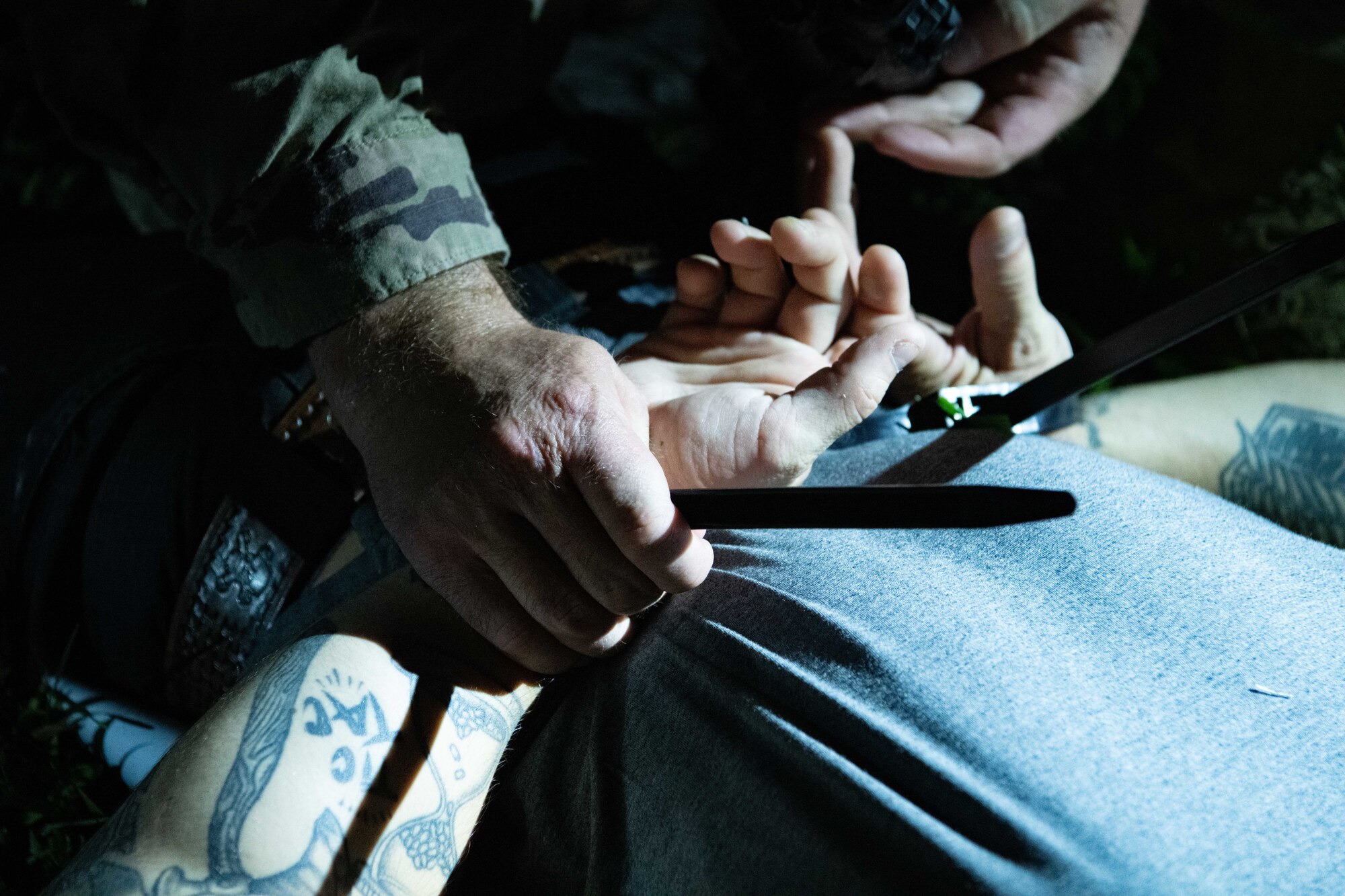 U.S. Air Force Staff Sgt. Christopher Koehler, 8th Security Forces Squadron patrolman, apprehends a simulated suspect during a training event at Kunsan Air Base, Republic of Korea, Sept. 11, 2022. The SFS personnel safely apprehended two suspects who attempted an unauthorized entry of the installation. (U.S. Air Force photo by Staff Sgt. Sadie Colbert)