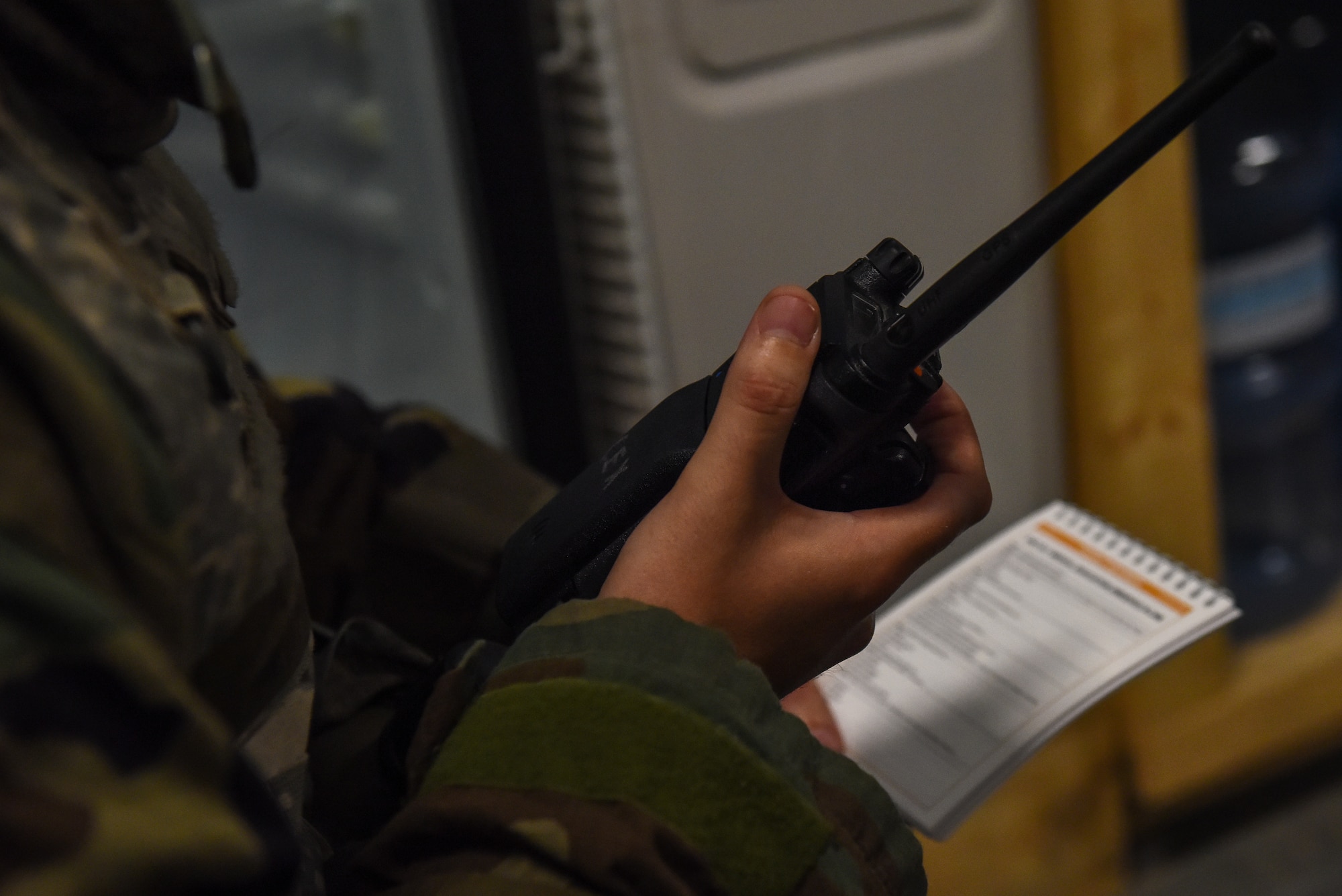 U.S. Air Force Staff Sgt. Zachary Sumstine, 8th Civil Engineer Squadron structural craftsman, relays a Medical Evacuation 9-Line report from his Airman’s Manual during a training event on Kunsan Air Base, Republic of Korea, Sept. 9, 2022. The Airman’s Manual provides quick references to items such as Mission Oriented Protective Posture (MOPP) levels and chemical, biological, radiological and nuclear (CBRNE) operations. (U.S. Air Force photo by Tech. Sgt. Timothy Dischinat)