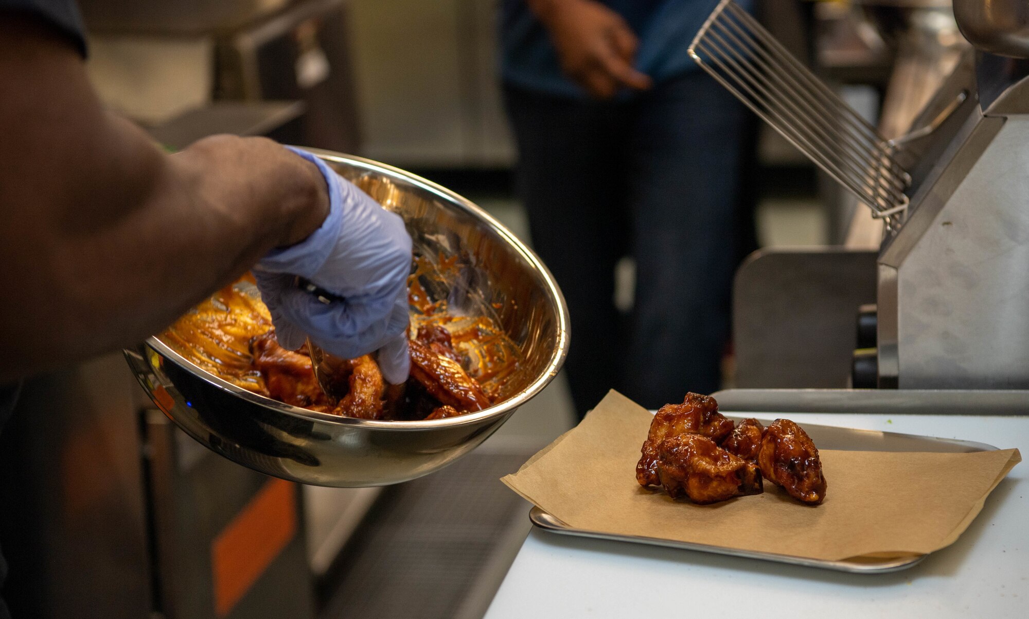 Cooks from the HEROES restaurant prepare food in the Kaiserslautern Military Community Center at Ramstein Air Base, Germany, Aug. 12, 2022.