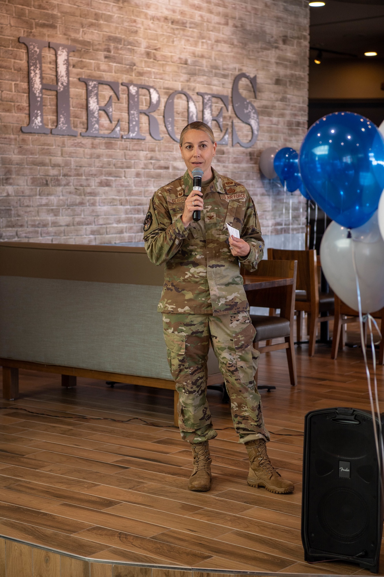 U.S. Air Force Col. Amy Glisson, 86th Mission Support Group commander, speaks in front of the HEROES restaurant during the grand opening at Kaiserslautern Military Community Center at Ramstein Air Base, Sept. 12, 2022.