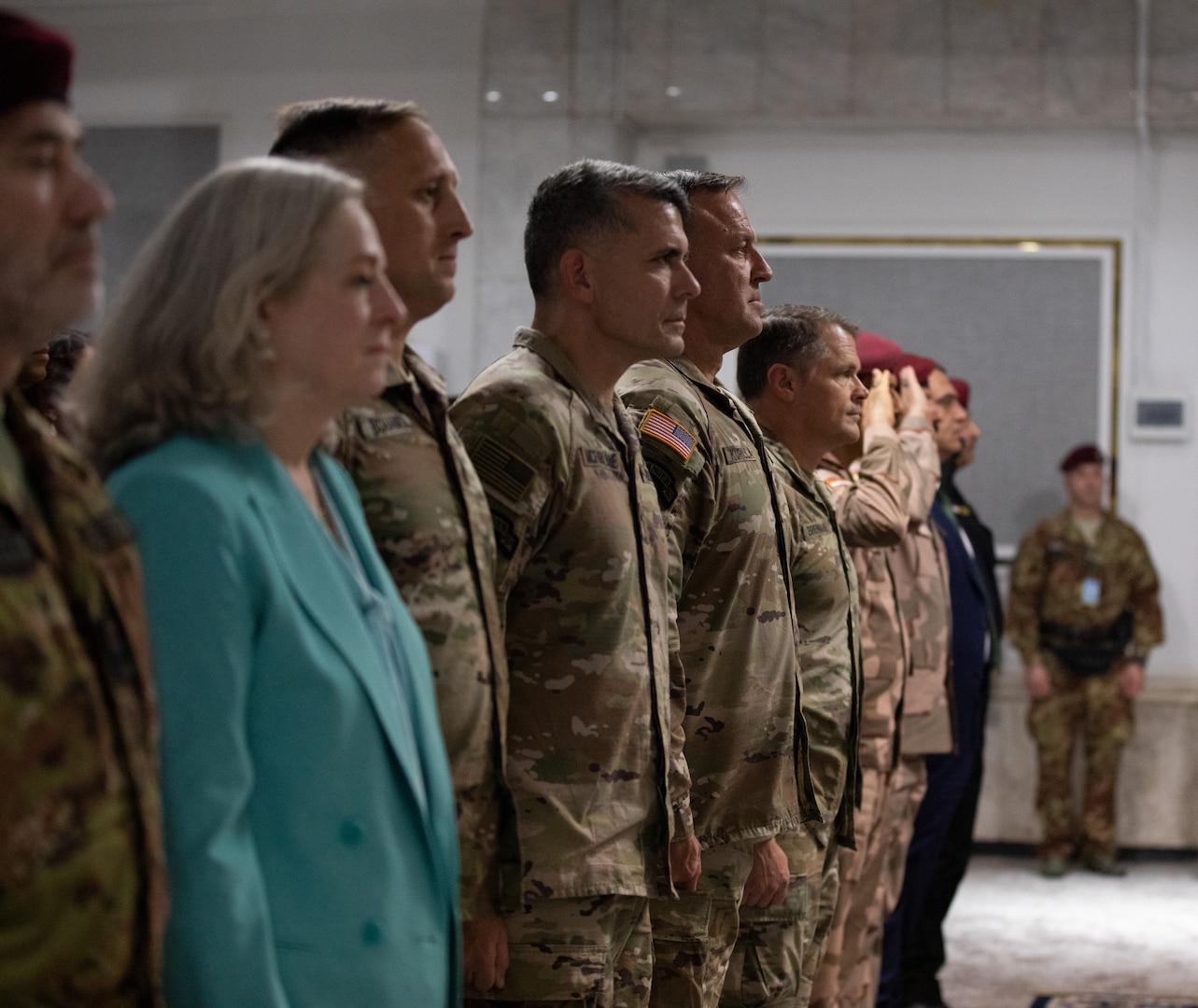 U.S. Army Maj. Gen. Matthew McFarlane, left, incoming commander of Combined Joint Task Force – Operation Inherent Resolve, Gen. Michael E. Kurilla, commander of U.S. Central Command, and Maj. Gen. John W. Brennan, outgoing commander of CJTF-OIR, pay respect during the playing of the national anthems at a transfer of authority ceremony in Baghdad, Iraq, Sept. 8 2022. CJTF-OIR remains steadfast in its commitment to advise, assist and enable partner forces in designated areas of Iraq and Syria as they secure the enduring defeat of Da’esh--the common Arabic term for ISIS or I.S.--and prevent the group’s reemergence. (U.S. Army photo by Sgt. Julio Hernandez)
