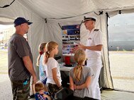 BALTIMORE (Sept.10, 2022) Lt. Cmdr. Chaselynn Watters, a microbiologist with Naval Medical Research Center (NMRC) speaks to Maryland Fleet Week and Flyover Baltimore attendees about NMRC's mobile laboratory capabilities. Maryland Fleet Week and Flyover is Baltimore's celebration of the sea services and provides an opportunity for the citizens of Maryland and the city of Baltimore to meet Sailors, Marines and Coast Guardsmen, as well as see firsthand the latest capabilities of today's maritime services. (U.S. Navy photo by Tommy Lamkin/Released)