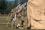 Members of the 137th Special Operations Wing Mission Sustainment Team construct a shelter during ground operations training Aug. 11, 2022, at Alpena Combat Readiness Training Center, Mich. The 137th SOW Airmen were supporting Northern Strike 22-2, the National Guard Bureau-sponsored exercise to validate the readiness of the joint and reserve force and demonstrate joint integration into the Agile Combat Employment concept.