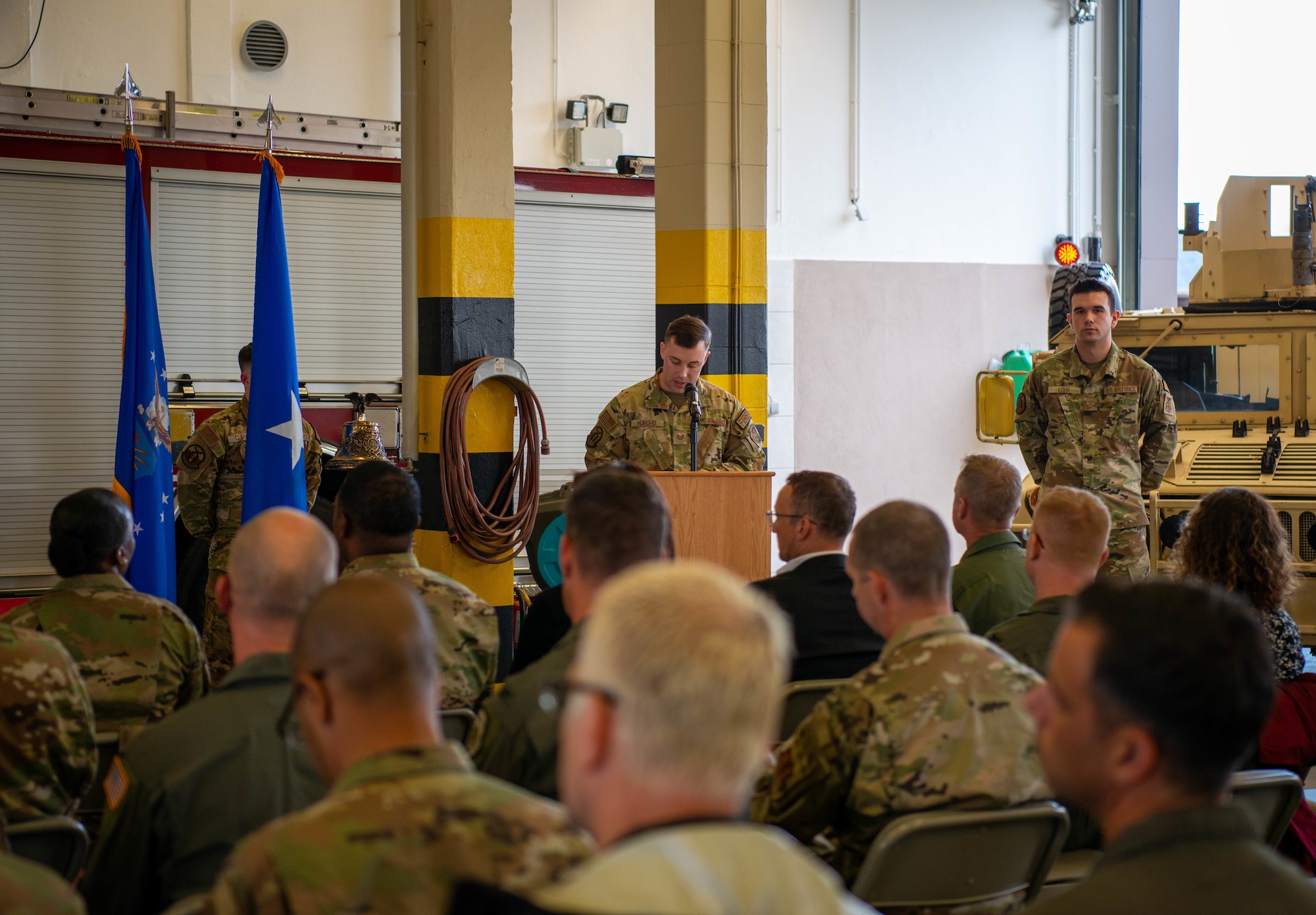 U.S. Air Force Tech. Sgt. Christopher Horoho, 86th Civil Engineer Squadron fire and emergency services firefighter, addresses the audience during the 9/11 memorial ceremony at Ramstein Air Base, Germany, Sept. 9, 2022.