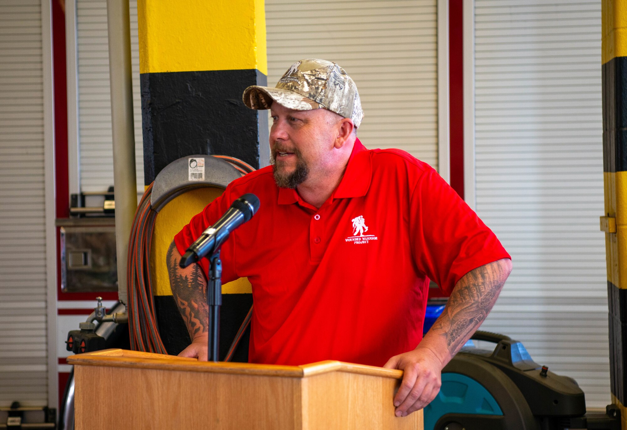 Brett Miller, former U.S. Army Guard firefighter, tells the audience about his time as a first responder during 9/11 during a ceremony at Ramstein Air Base, Germany, Sept. 9, 2022.