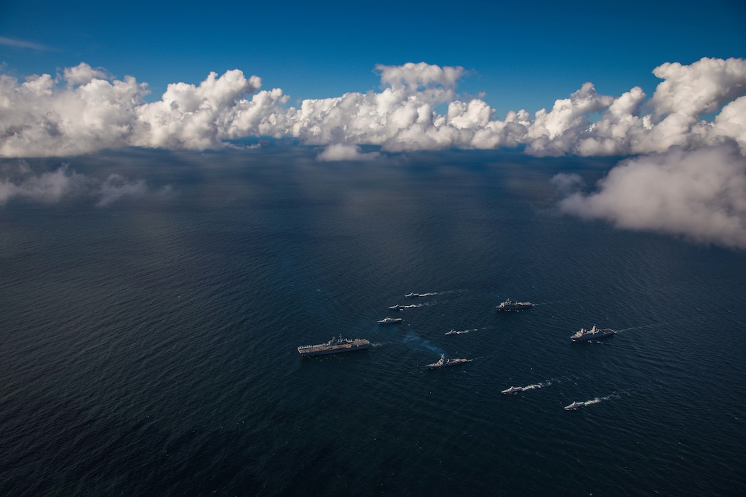 Ships sail in formation.