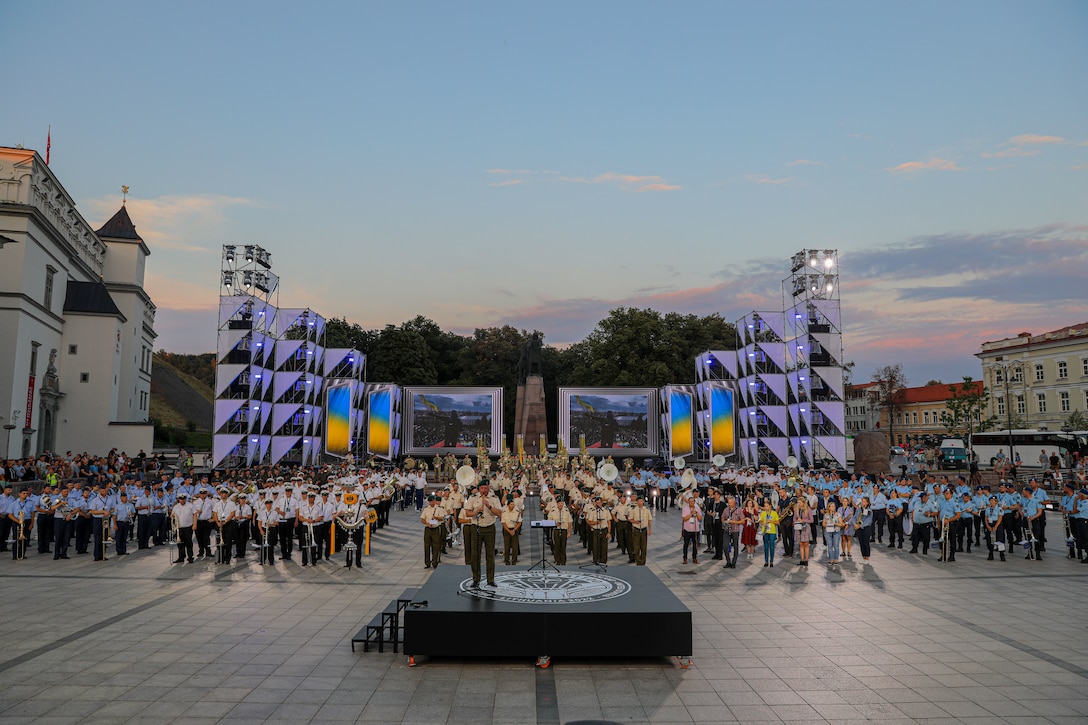 Military bands perform at an outdoor event.