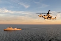 Baltic Sea (Aug. 14, 2022) Two U.S. Marine Corps AH-1W Super Cobras, attached to the Marine Medium Tiltrotor Squadron 263, fly above the Whidbey Island-class dock landing ship USS Gunston Hall (LSD 44), Aug. 14, 2022. Gunston Hall (LSD 44) is part of the Kearsarge Amphibious Ready Group and embarked 22nd Marine Expeditionary Unit, under the command and control of Task Force 61/2, on a scheduled deployment in the U.S. Naval Forces Europe area of operations, employed by U.S. Sixth Fleet, to defend U.S. allied and partner interests. (U.S. Navy Photo by Seaman Cayla Lopez)