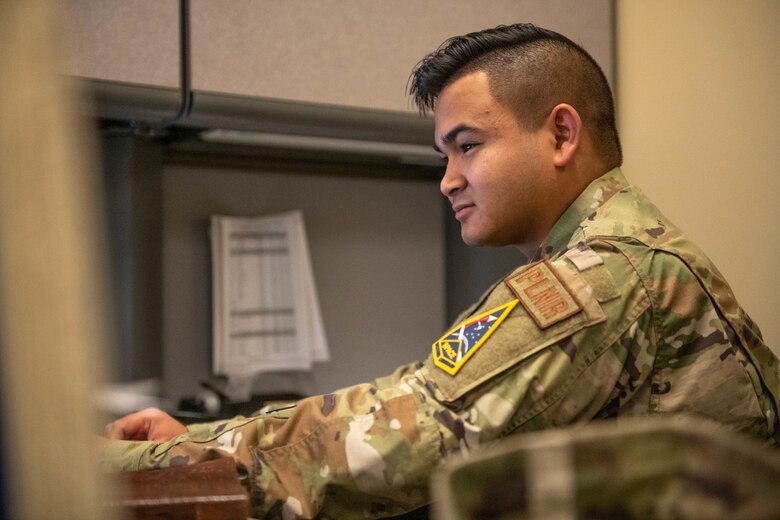U.S. Air Force Staff Sgt. Eli Haley, 45 Logistics Readiness Squadron non commissioned officer in charge of plans and programs, works at his desk on Patrick Space force Base, Aug. 11, 2022. While managing all incoming Airmen and Guardians downrange, Logistic Plans also coordinate the movement of deployed personnel back to their home station. (U.S. Space Force photo by Senior Airman Samuel Becker)