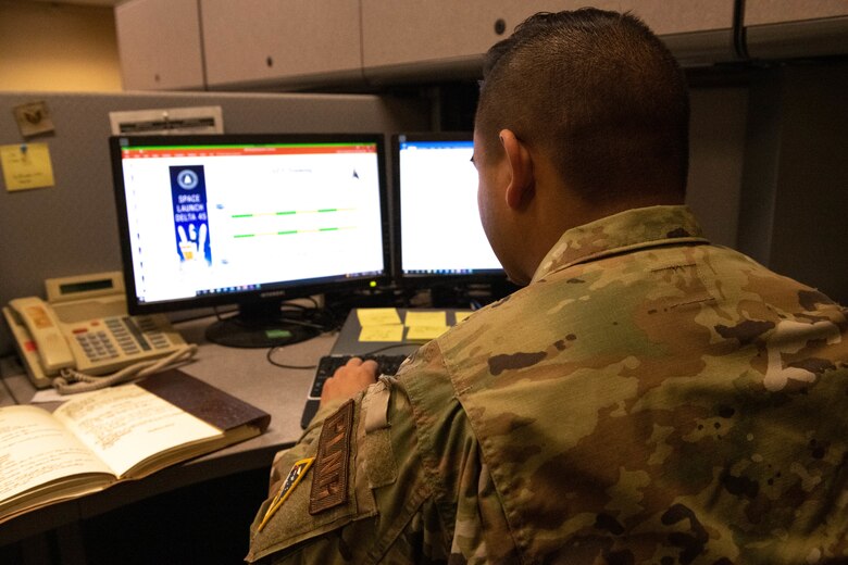 U.S. Air Force Staff Sgt. Eli Haley, 45 Logistics Readiness Squadron Non Commissioned Officer In Charge of plans and programs, works at his desk on Patrick Space force Base, Aug. 11, 2022. While managing all incoming Airmen and Guardians downrange, Logistic Plans also coordinate the movement of deployed personnel back to their home station. (U.S. Space Force photo by Senior Airman Samuel Becker)