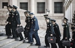 Chinese People’s Liberation Army members and military delegates arrive at Great Hall of the People