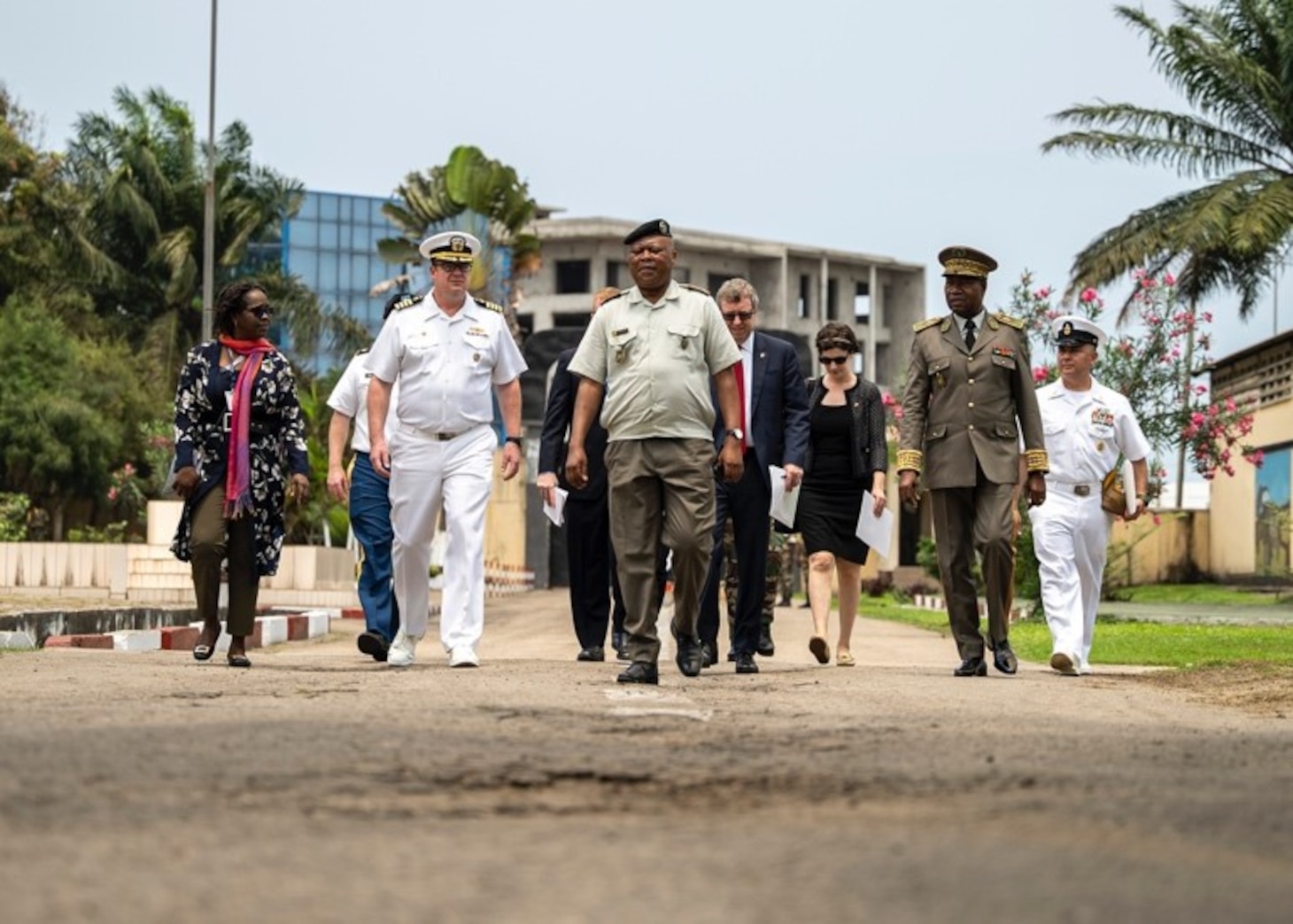 (Sep. 12, 2022) Capt. Chad Graham, commanding officer of the Lewis B. Puller-class expeditionary sea base USS Hershel "Woody" Williams (ESB 4), walks with Republic of Congo senior military leaders, embassy staff and dignitaries while visiting an Armed Forces of the Republic of Congo installation, Sep. 12, 2022. Hershel "Woody" Williams is rotationally deployed to the U.S. Naval Forces Africa area of operations, employed by U.S. Sixth Fleet, to defend U.S., allied and partner interests.
