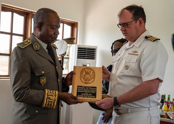 (Sep. 12, 2022) Capt. Chad Graham, right, commanding officer of the Lewis B. Puller-class expeditionary sea base USS Hershel "Woody" Williams (ESB 4), exchanges gifts with Armed Forces of the Republic of Congo Gen. Jean Olessongo Ondaye, military and defense zone commander, Sep. 12, 2022. Hershel "Woody" Williams is rotationally deployed to the U.S. Naval Forces Africa area of operations, employed by U.S. Sixth Fleet, to defend U.S., allied and partner interests.