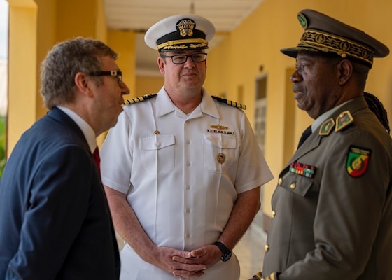 (Sep. 12, 2022) Capt. Chad Graham, center, commanding officer of the Lewis B. Puller-class expeditionary sea base USS Hershel "Woody" Williams (ESB 4), speaks with Ambassador Eugene S. Young, left, U.S. Ambassador to Republic of Congo, and Armed Forces of the Republic of Congo Gen. Jean Olessongo Ondaye, military and defense zone commander, Sep. 12, 2022. Hershel "Woody" Williams is rotationally deployed to the U.S. Naval Forces Africa area of operations, employed by U.S. Sixth Fleet, to defend U.S., allied and partner interests.