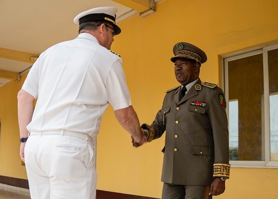 (Sep. 12, 2022) Armed Forces of the Republic of Congo Gen. Jean Olessongo Ondaye, right, military and defense zone commander, greets Capt. Chad Graham, commanding officer of the Lewis B. Puller-class expeditionary sea base USS Hershel "Woody" Williams (ESB 4), Sep. 12, 2022. Hershel "Woody" Williams is rotationally deployed to the U.S. Naval Forces Africa area of operations, employed by U.S. Sixth Fleet, to defend U.S., allied and partner interests.