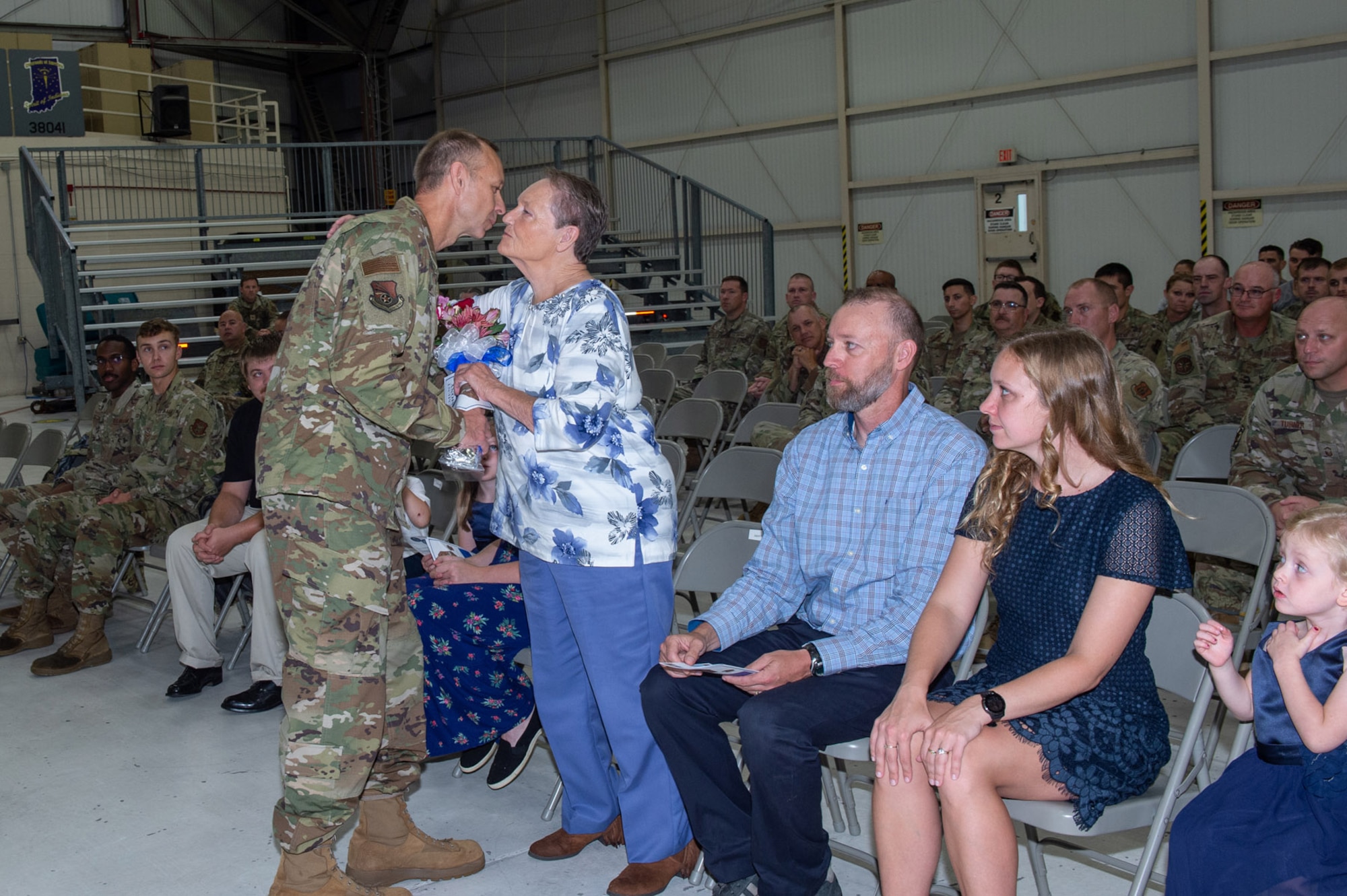 Chief Master Sgt. Christopher Feltis, 434th Maintenance Squadron assistant senior enlisted leader, presents his mother with flowers, during his retirement ceremony at Grissom Air Reserve Base, Ind. on Sept. 11, 2022. Feltis’ retirement was effective Apr. 28, 2022, with a total of more than 32 years of service. (U.S. Air Force photo by Staff Sgt. Alexis Culbert)