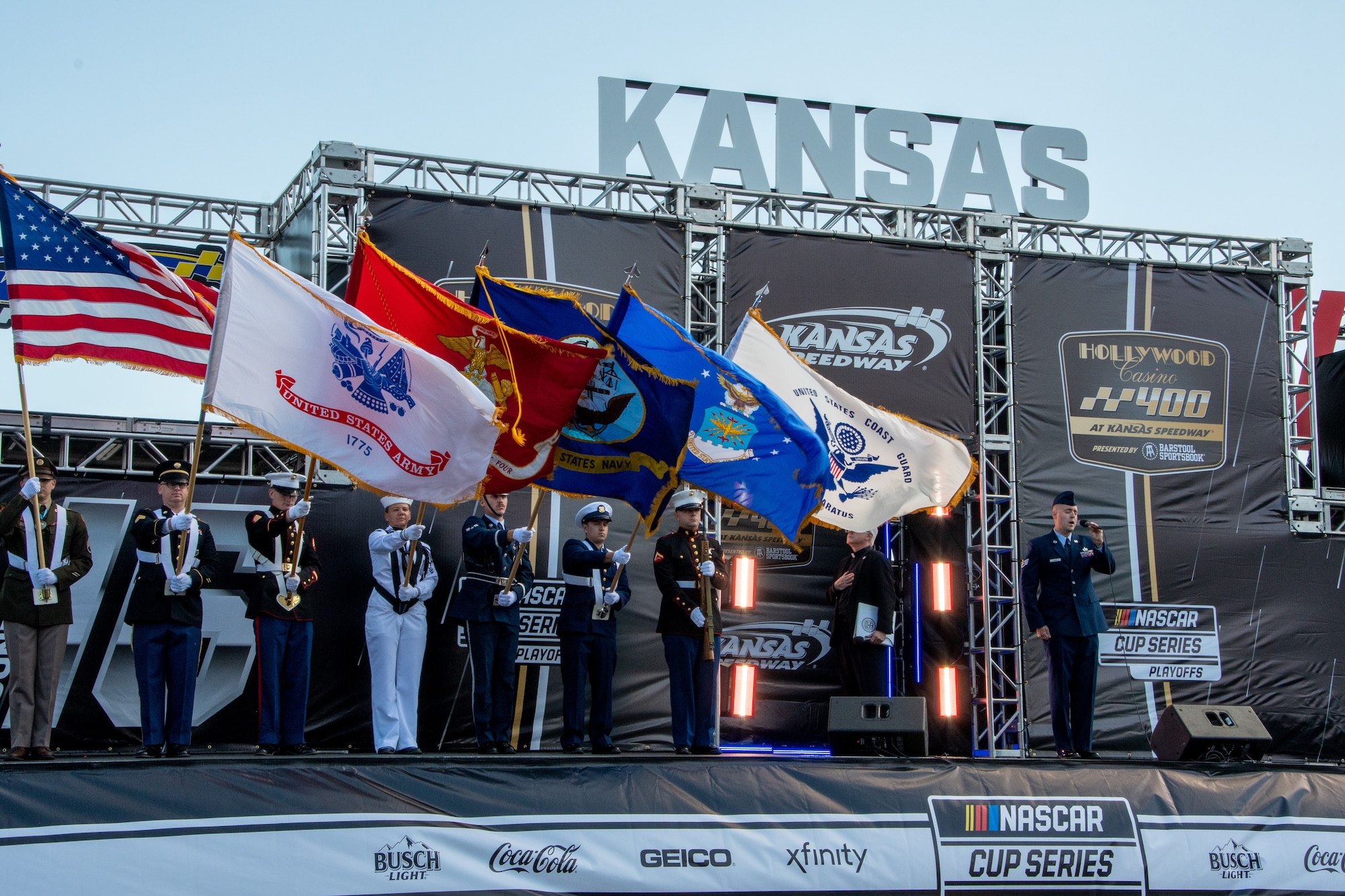 A Joint Color Guard presents the colors during the National Anthem at the NASCAR Hollywood Casino 400 at the Kansas Speedway in Kansas City, Kansas, Sept. 11, 2022. Whiteman Air Force Base Airmen supported pre-race festivities to represent the U.S. Air Force. (U.S. Air National Guard photo by Airman 1st Class Phoenix Lietch)