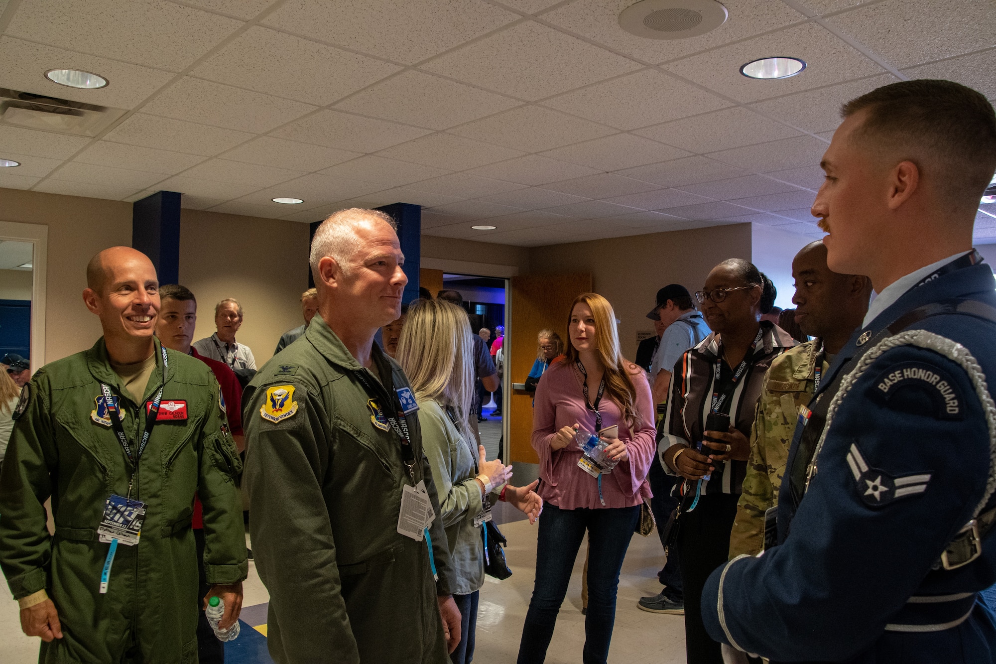 U.S. Air Force Col. Matthew Calhoun, 131st Bomb Wing commander, and Col. Daniel Diehl, 509th Bomb Wing commander, greets Senior Airman Blaske Wilson, Whiteman Air Force Base Honor Guard member, at the Kansas Speedway in Kansas City, Kansas, Sept. 11, 2022. Leaders and Airmen accompany ground crew to flyovers to represent Team Whiteman and tell the Air Force story. (U.S. Air National Guard photo by Airman 1st Class Phoenix Lietch)